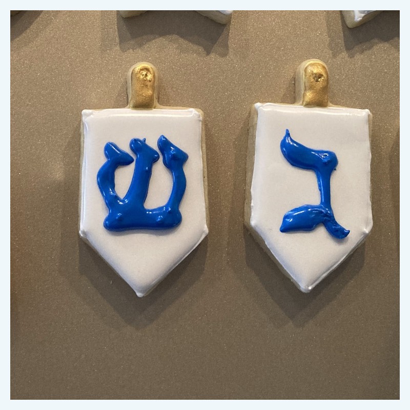 Small cookies — dreidels with Hebrew letters